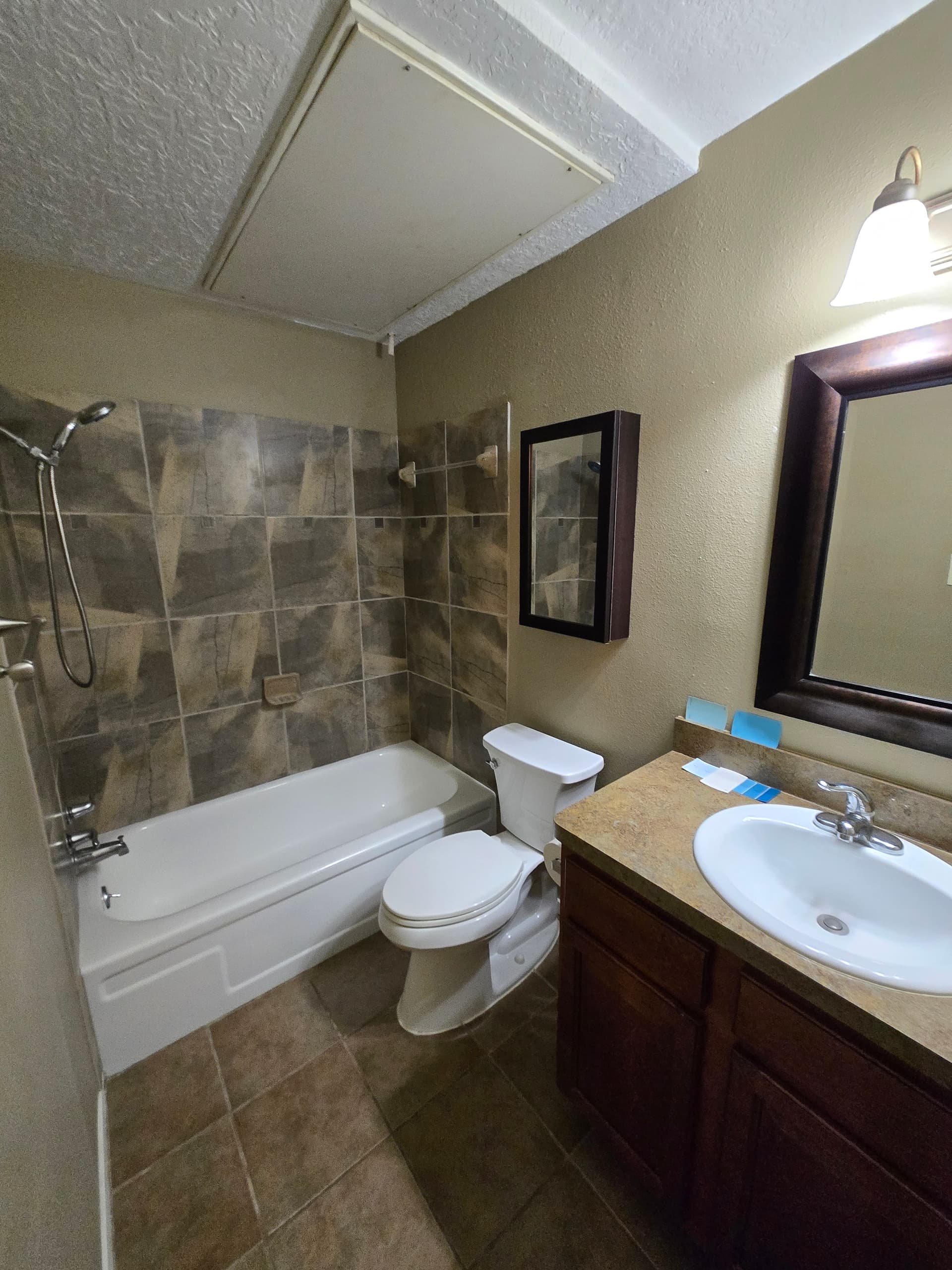 Remodeled bathroom with new vanity and tile
